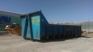 One of our blue 20 yd³ Roll-on, Roll-off skips in the storage yard.